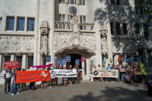 Campaigners with banners outside the Supreme Court hearing on the Horse Hill case, 21 June 2023