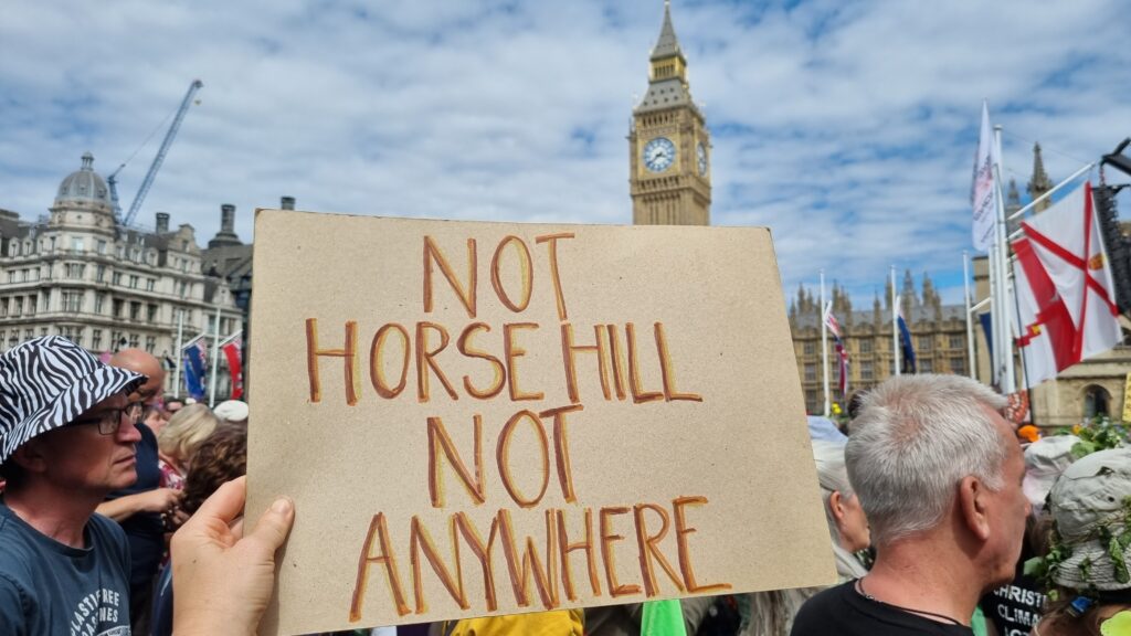 Placard reading 'Not Horse Hill, Not Anywhere' in front of Big Ben